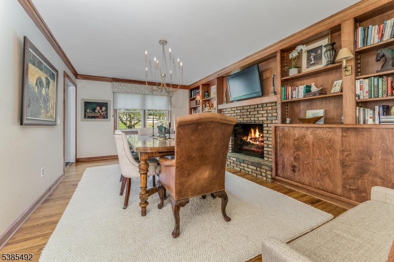 48 West Main Street Mendham, NJ 07945 - Photo 3 of 28 a dining room with furniture and a book shelf