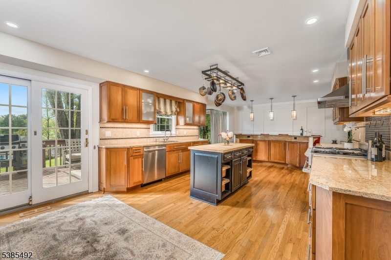 48 West Main Street Mendham, NJ 07945 - Photo 9 of 28 a kitchen with stainless steel appliances granite countertop a stove and a sink