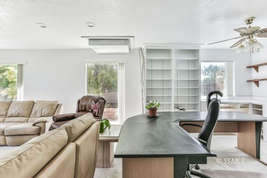 712 East Kendall Avenue Ridgecrest, CA 93555 - Photo 21 of 50 a living room with furniture and a window