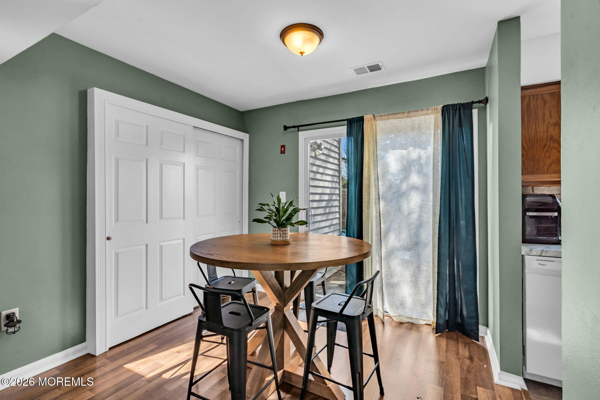 39 Independence Court Jackson, NJ 08527 - Photo 11 of 24 a view of a dining room with furniture and wooden floor