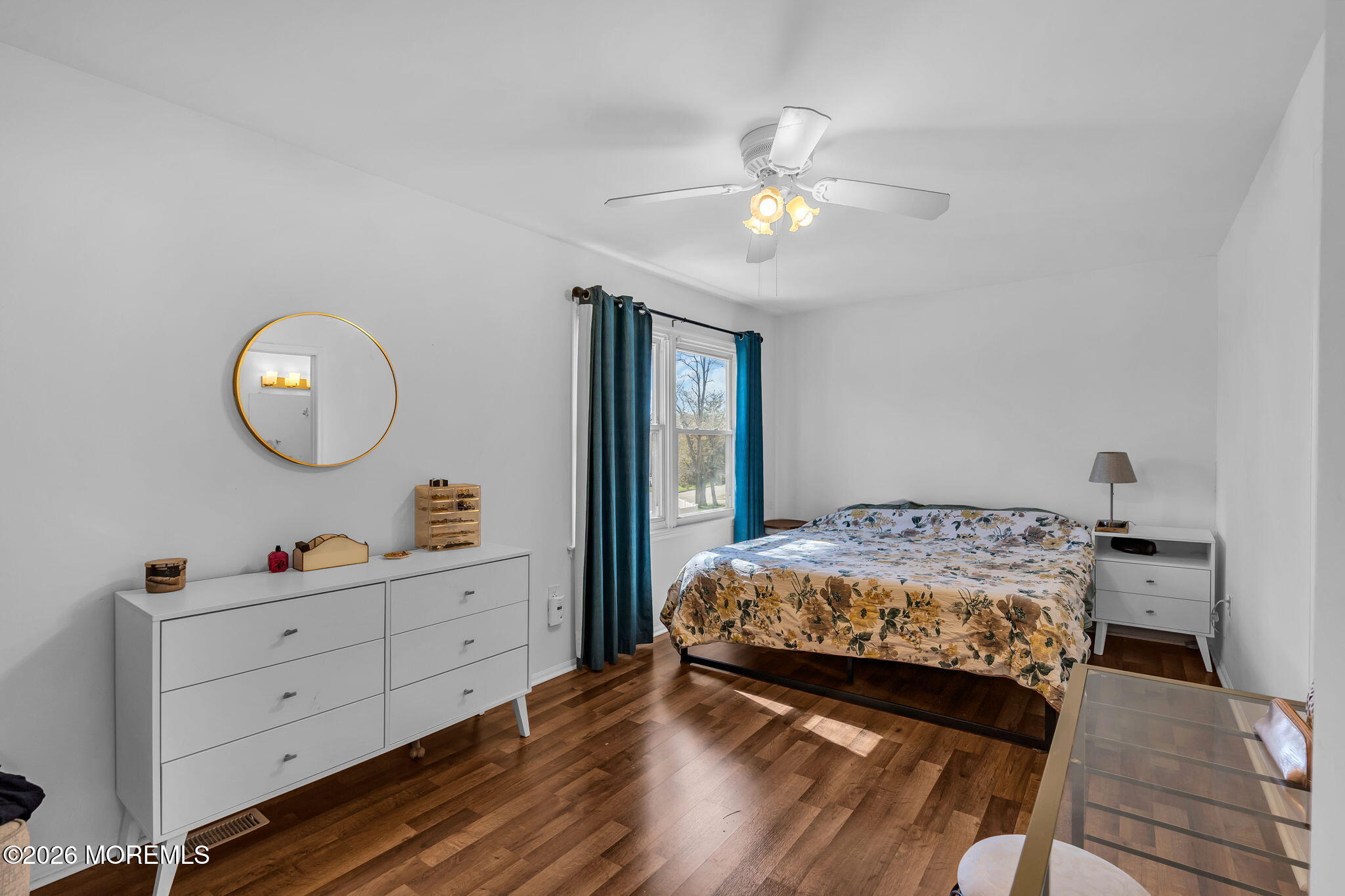 39 Independence Court Jackson, NJ 08527 - Photo 13 of 24 a bedroom with a large bed and a chandelier