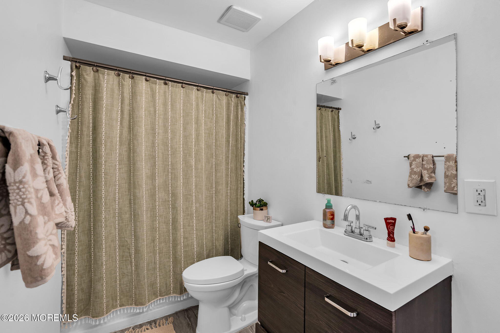 39 Independence Court Jackson, NJ 08527 - Photo 16 of 24 a bathroom with a sink vanity mirror and toilet