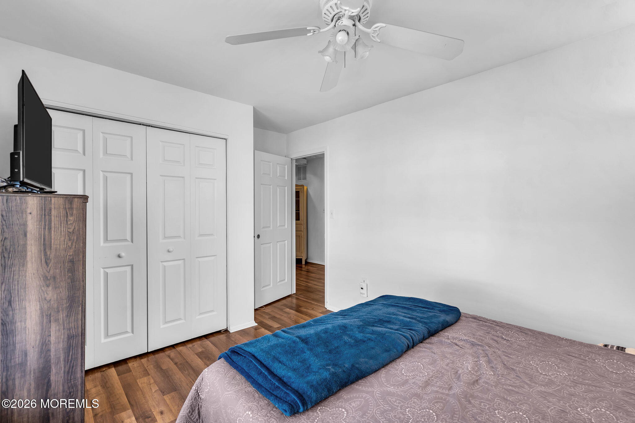 39 Independence Court Jackson, NJ 08527 - Photo 19 of 24 a bedroom with a bed and a chandelier