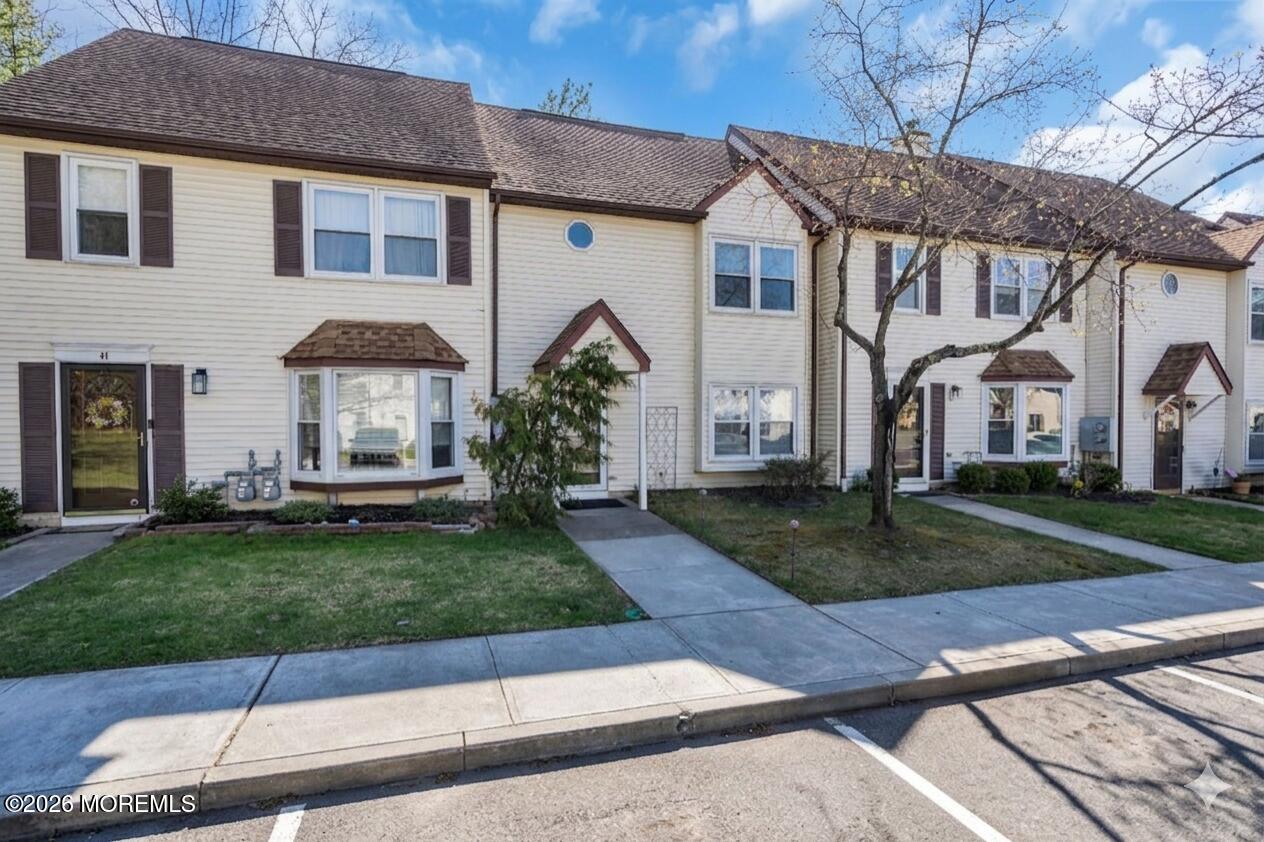 39 Independence Court Jackson, NJ 08527 - Photo 2 of 24 a front view of a house with a garden