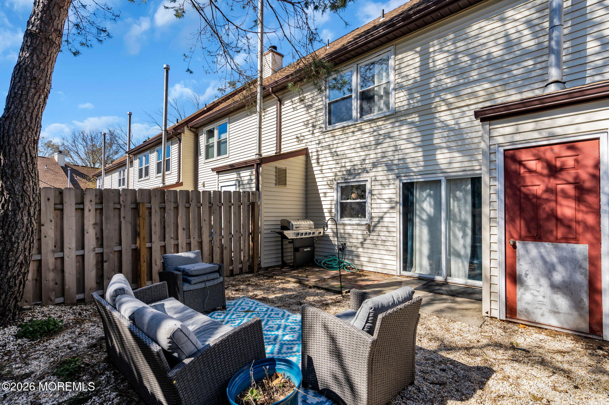 39 Independence Court Jackson, NJ 08527 - Photo 22 of 24 a view of a patio with a table and chairs