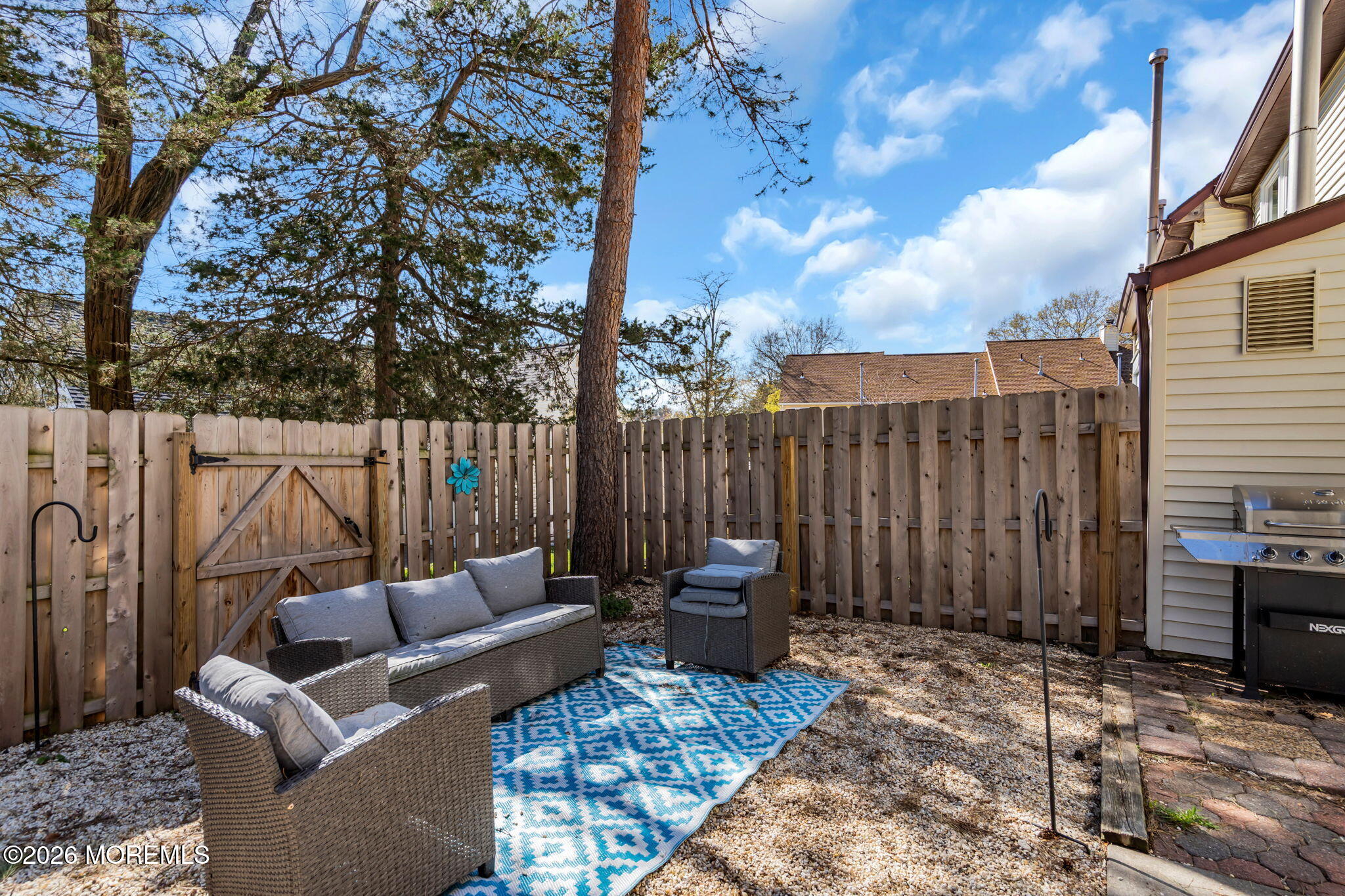 39 Independence Court Jackson, NJ 08527 - Photo 23 of 24 a backyard of a house with barbeque oven table and chairs