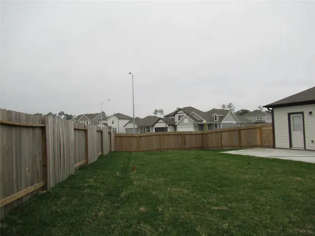 a front view of a house with a small yard and plants