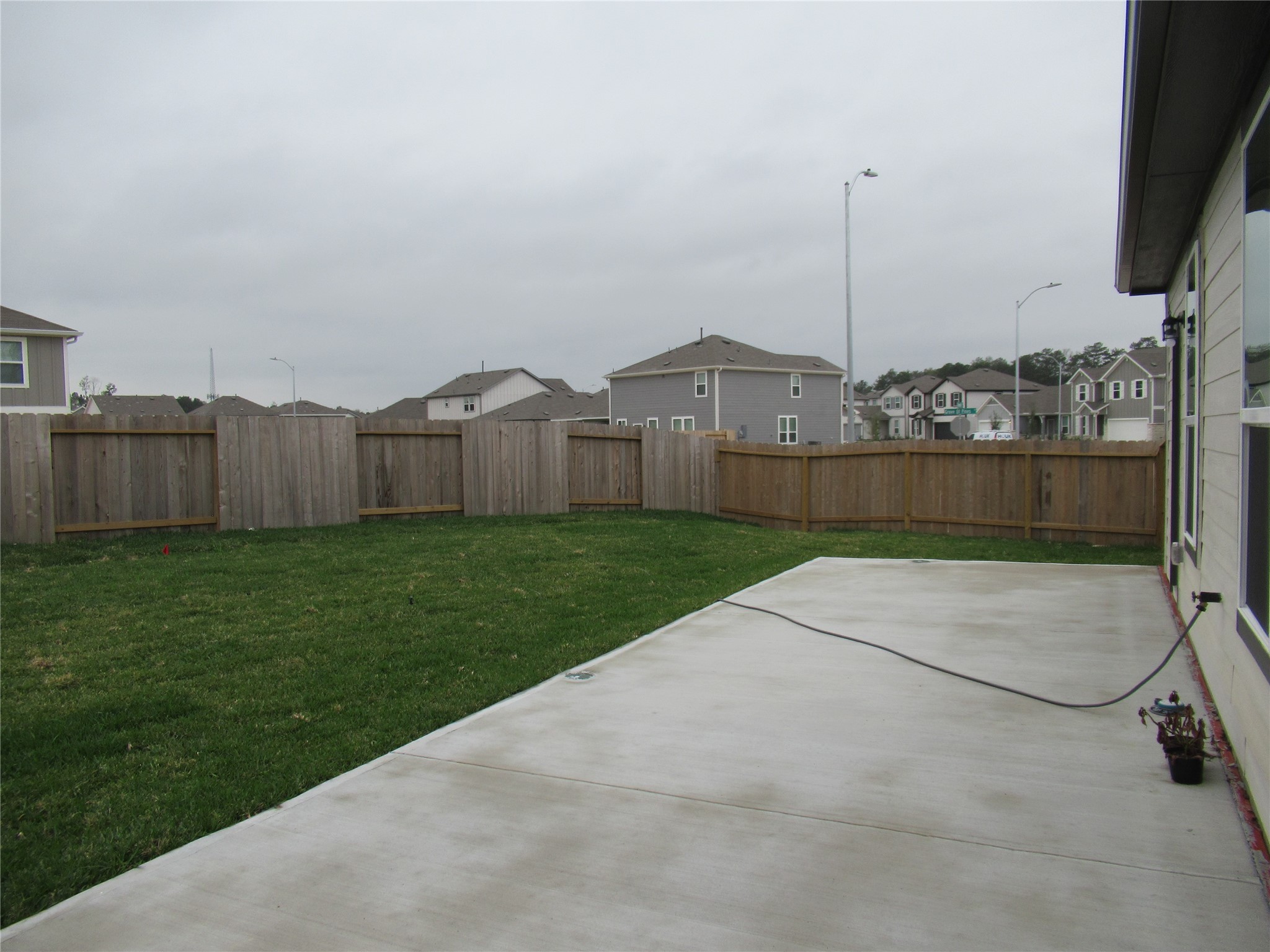 23415 Pinetum Cir Spring Spring, TX 77373 - Photo 16 of 17 a view of a street with a big yard and a large tree