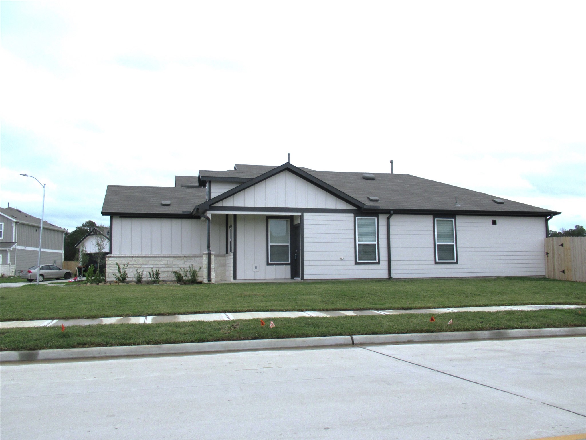 23415 Pinetum Cir Spring Spring, TX 77373 - Photo 17 of 17 a front view of a house with a small yard and plants