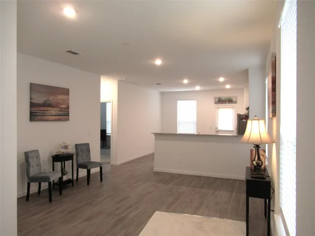 a view of kitchen and dining area with chandelier
