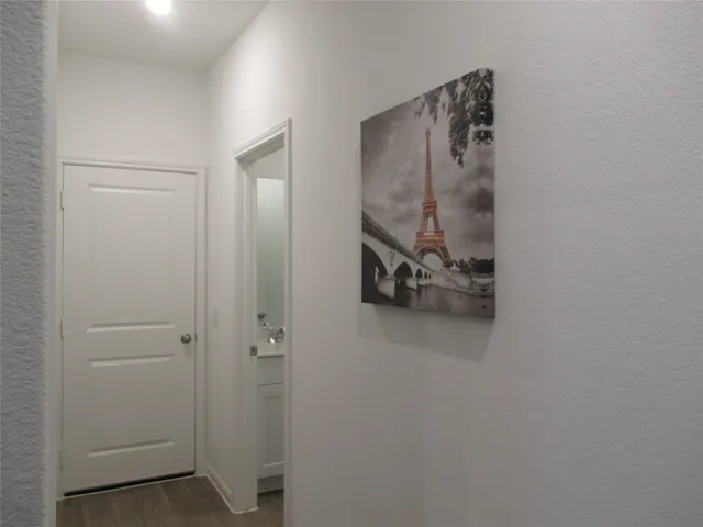 a view of an empty room and a window