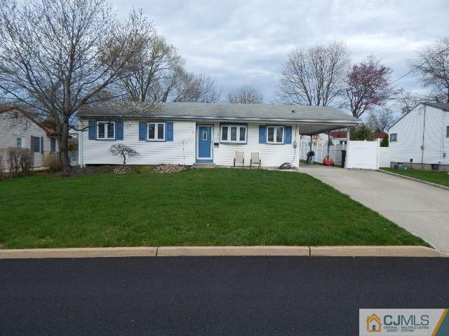 3042 Cheesequake Road Old Bridge, NJ 08859 - Photo 3 of 22 a front view of a house with a garden and trees