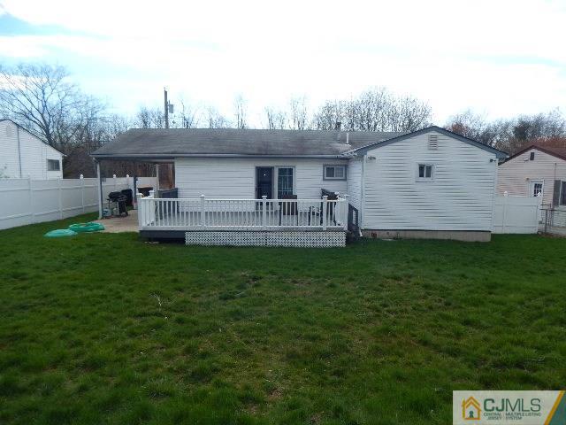 3042 Cheesequake Road Old Bridge, NJ 08859 - Photo 8 of 22 a front view of a house with a yard and outdoor seating