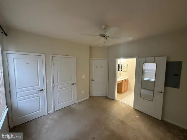 a view of empty room with a bathroom