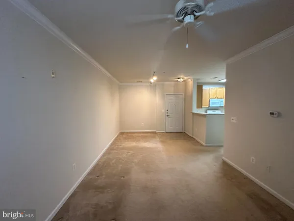 an empty room with a empty space and windows