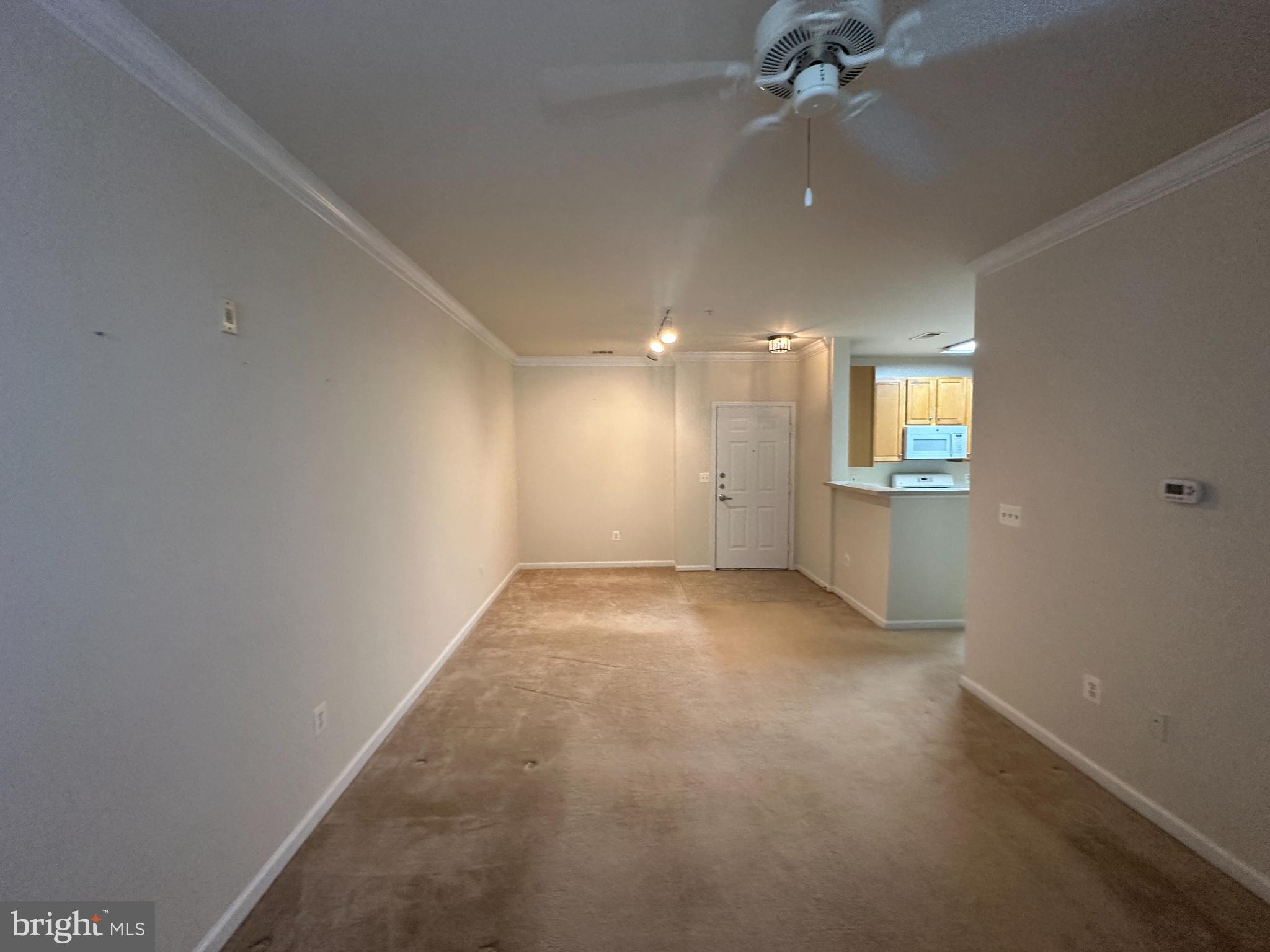 12001 Market Street, Unit 306 Reston, VA 20190 - Photo 5 of 13 Spacious, light-filled living area awaits you.