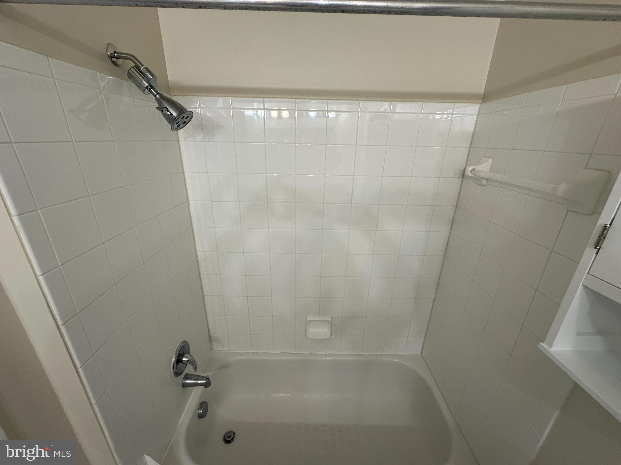 12001 Market Street, Unit 306 Reston, VA 20190 - Photo 7 of 13 Modern shower space with clean tiles.