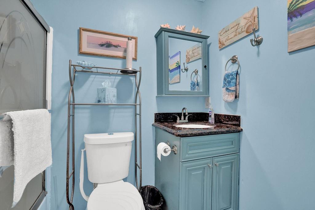 1555 Rock Springs Road Buford, GA 30519 - Photo 13 of 27 a white toilet sitting next to a bathroom sink