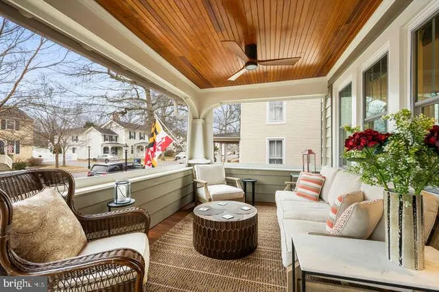 a bathroom with a granite countertop sink a large mirror and a window