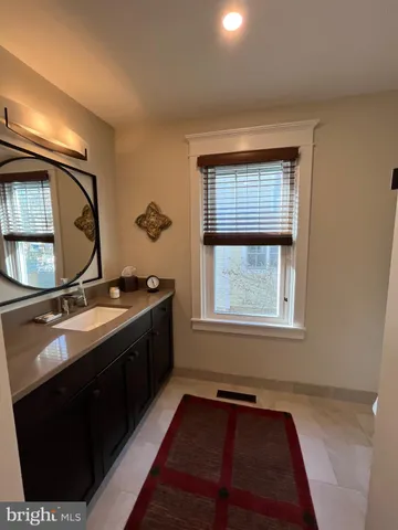 a bedroom with a large bed and a large window