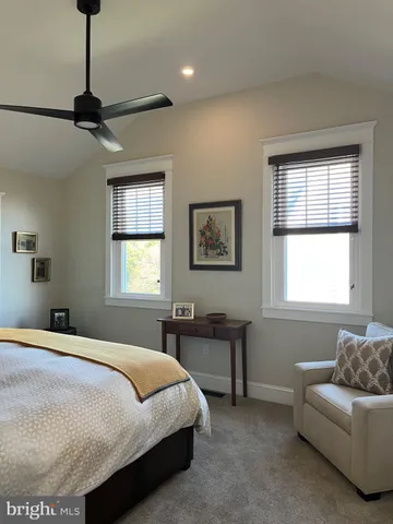 a bedroom with a bed and a lamp