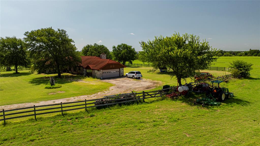 12520 Fm 455 E Pilot Point East Pilot Point, TX 76258 - Photo 32 of 37 a view of a swimming pool with a garden and seating area