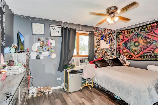 a bedroom with bed and a window