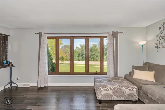 a bedroom with bed and window