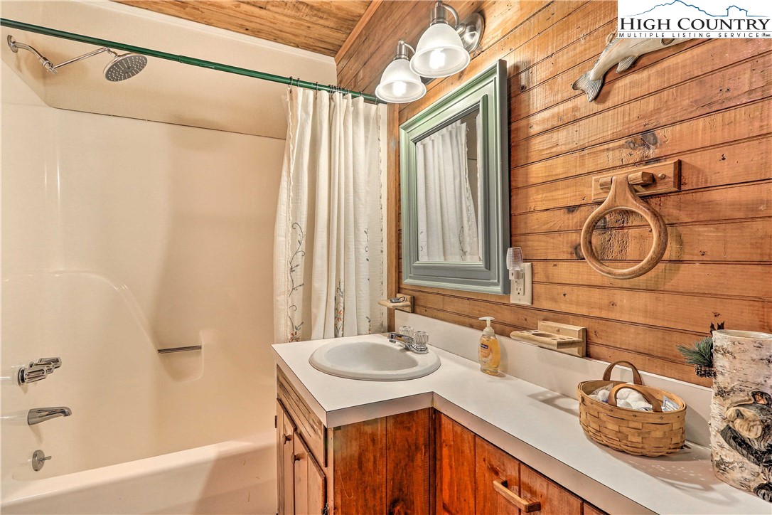 2280 Garvey Bridge Road Crumpler, NC 28617 - Photo 13 of 40 a bathroom with a sink and a mirror