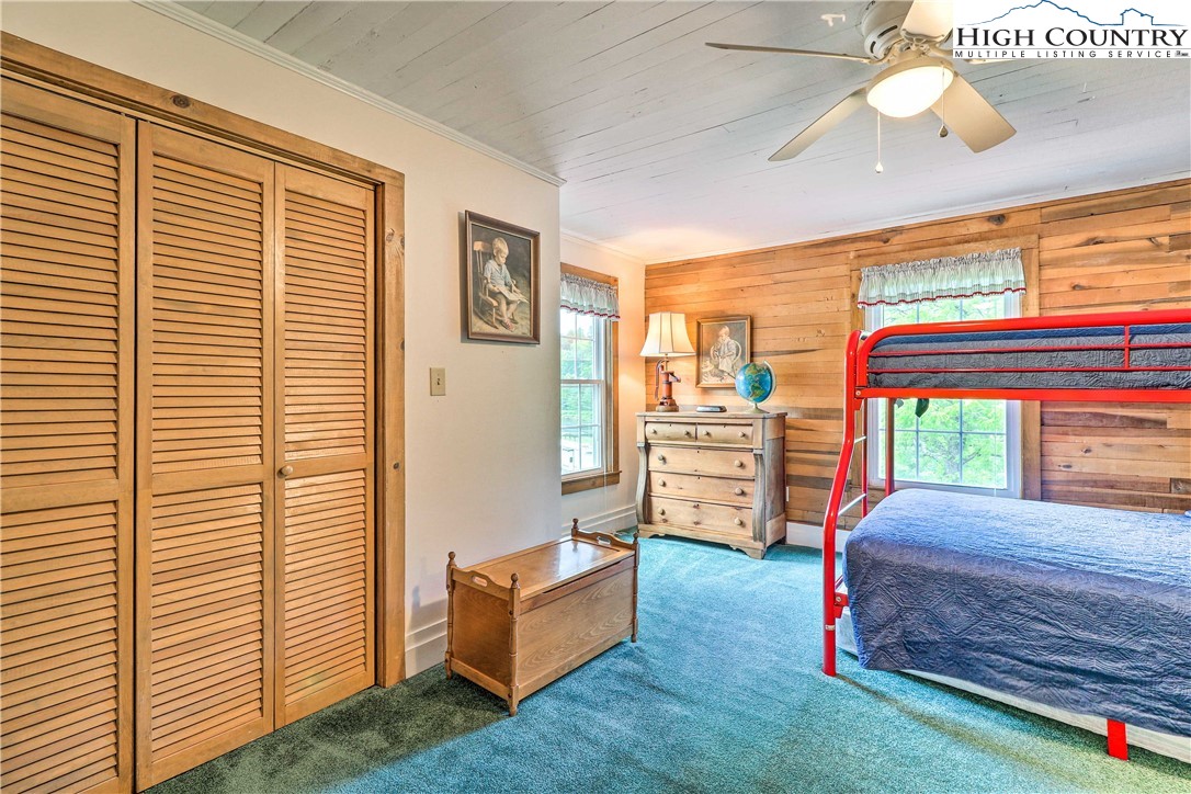 2280 Garvey Bridge Road Crumpler, NC 28617 - Photo 24 of 40 a bedroom with a bed and a large window