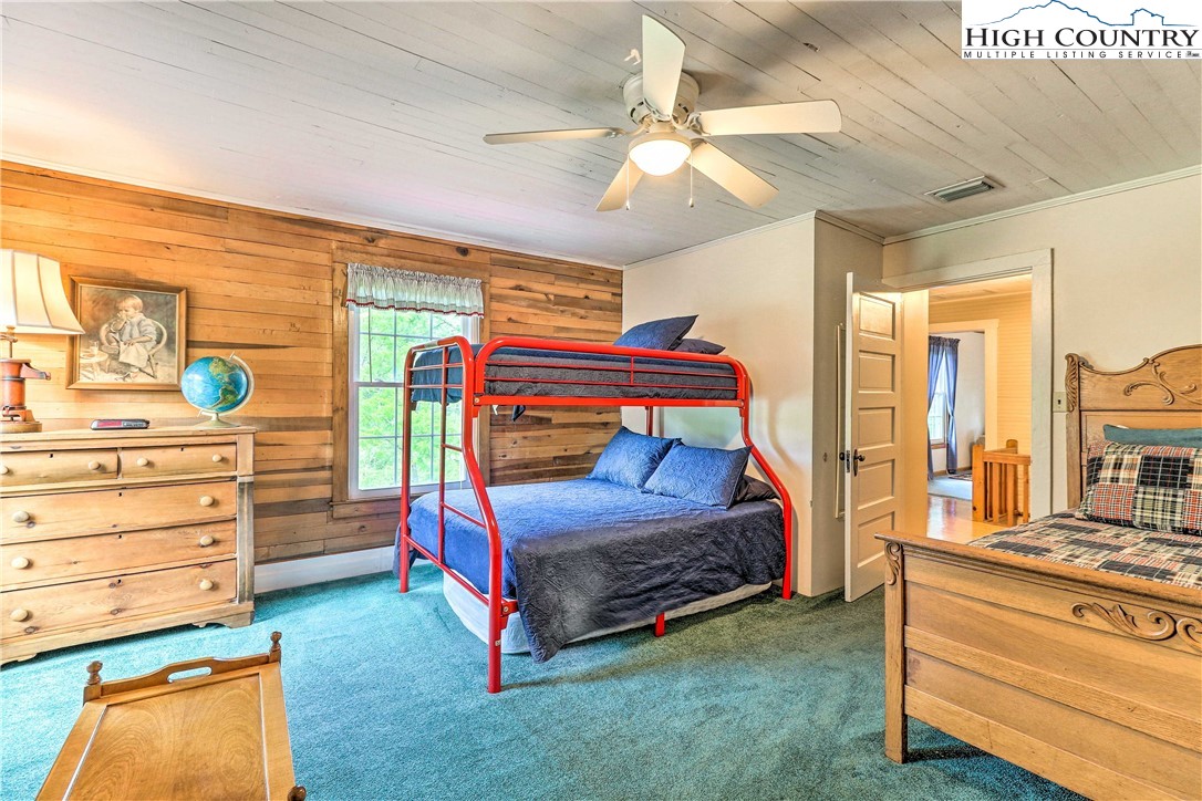 2280 Garvey Bridge Road Crumpler, NC 28617 - Photo 25 of 40 a bedroom with a bed and a dresser