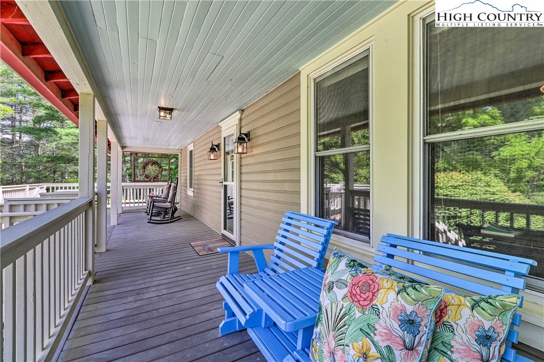 2280 Garvey Bridge Road Crumpler, NC 28617 - Photo 28 of 40 a balcony with furniture and wooden floor