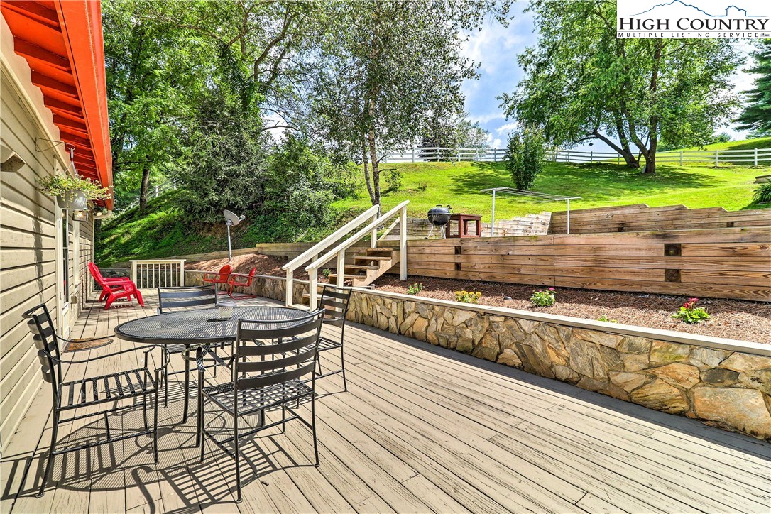 2280 Garvey Bridge Road Crumpler, NC 28617 - Photo 31 of 40 a view of a chair and tables on the deck