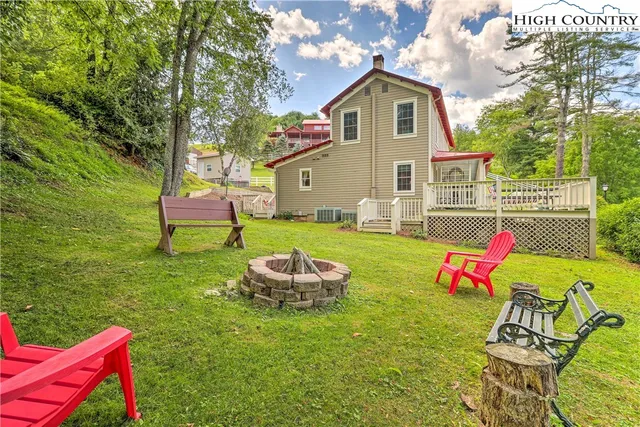 a front view of a house with a yard table and chairs