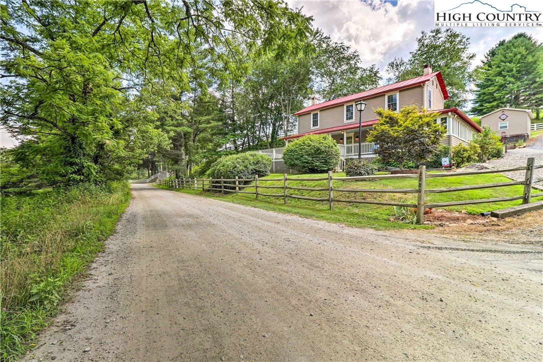 2280 Garvey Bridge Road Crumpler, NC 28617 - Photo 40 of 40 a front view of a house with a yard
