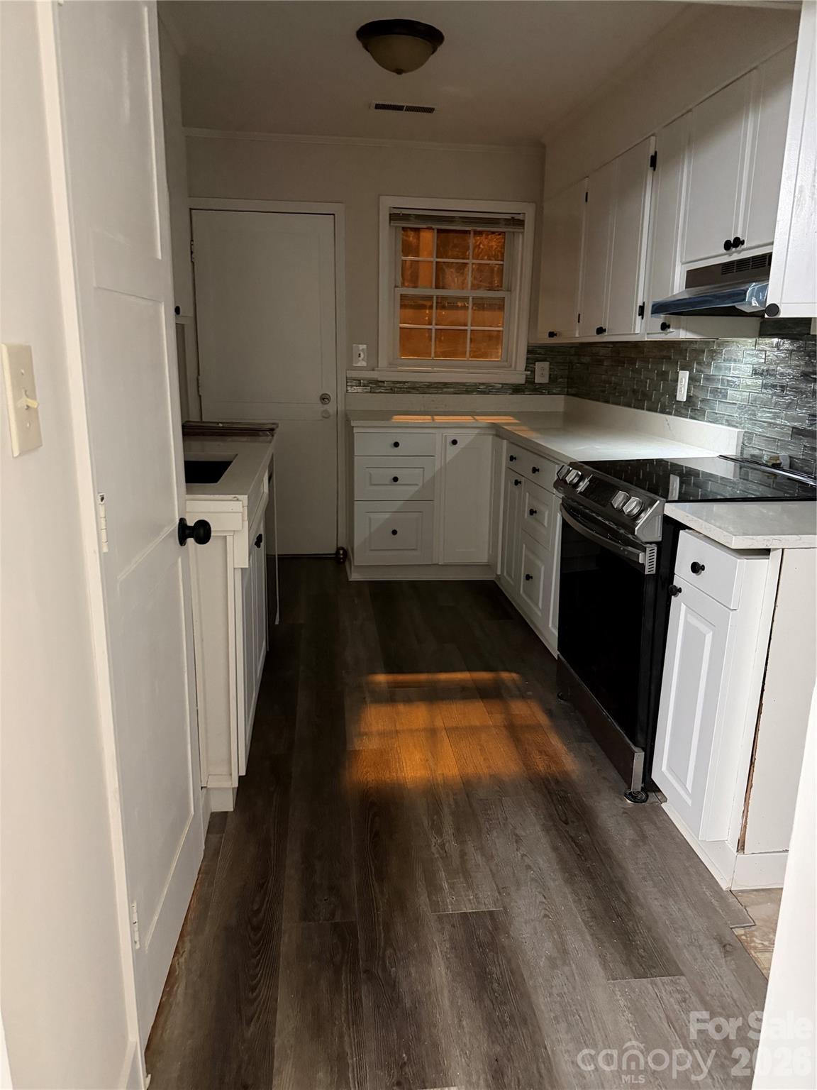 250 Nixon Road, Unit 19 Belmont, NC 28012 - Photo 20 of 27 a kitchen with granite countertop a stove a sink and a refrigerator