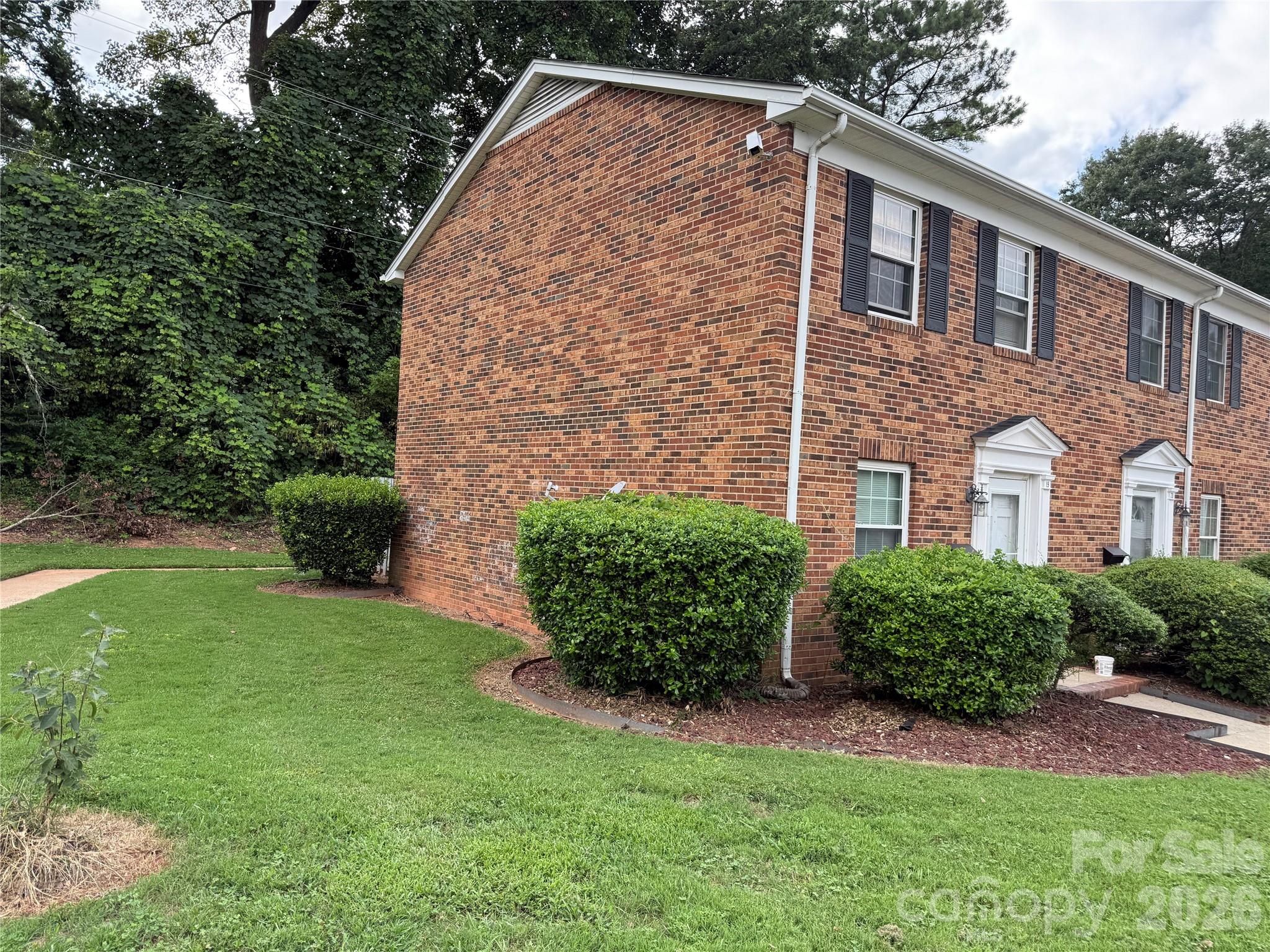 250 Nixon Road, Unit 19 Belmont, NC 28012 - Photo 3 of 27 a front view of a house with garden