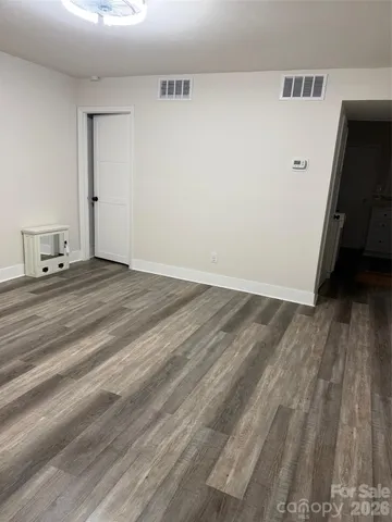 a view of a livingroom with wooden floor