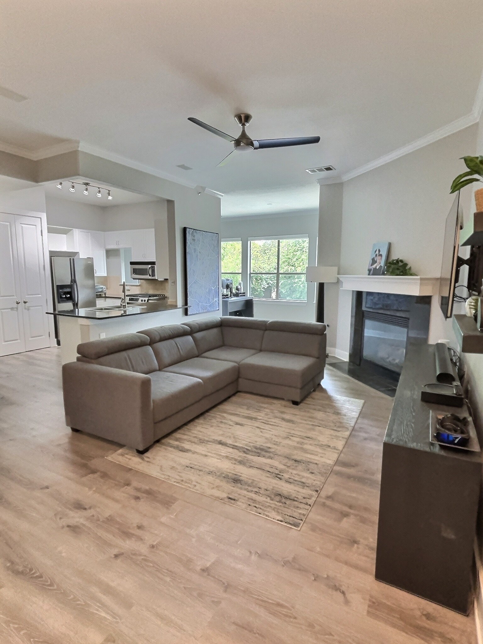 2216 Thornton Road, Unit 421 Austin, TX 78704 - Photo 1 of 31 The living room is large space with high ceilings and open to the kitchen and dining area. For perspective, the TV stand under the Tv is 100 inches long!