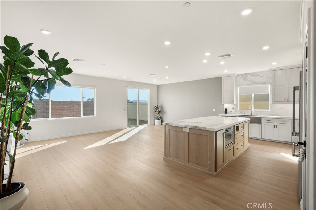19795 Beavertail Way Riverside, CA 92508 - Photo 13 of 39 Great Room - showing family room, dining area and kitchen