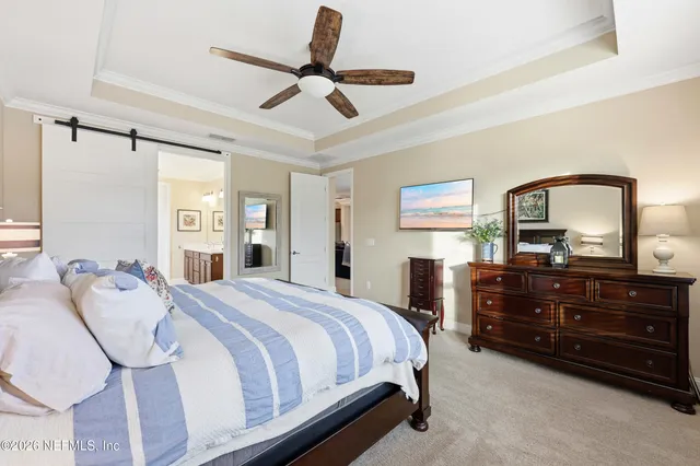 a spacious bathroom with a double vanity sink a mirror and a shower