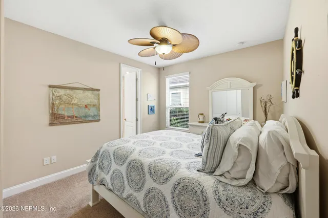 a bathroom with a sink toilet and a mirror