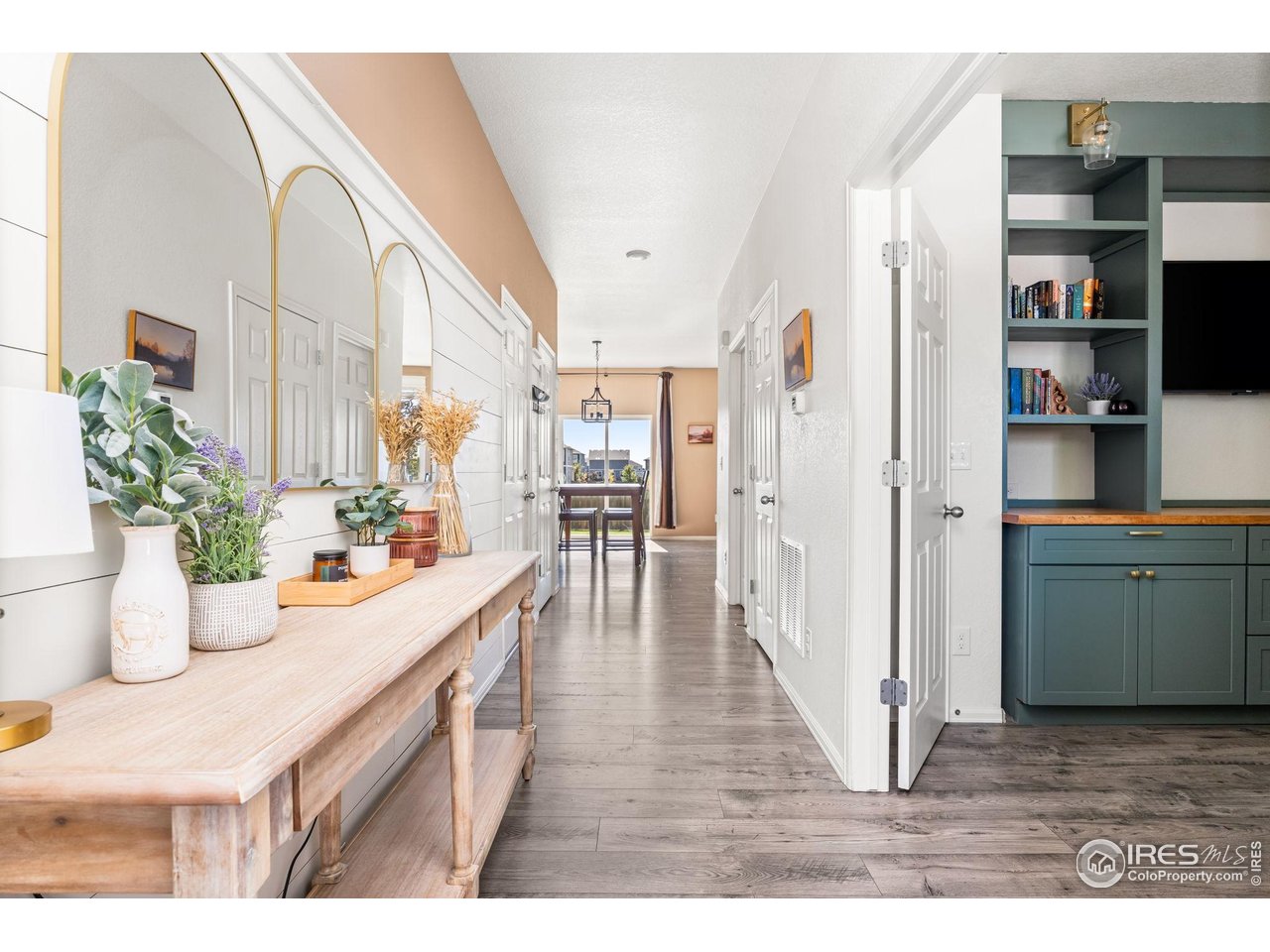 a view of a kitchen and an entryway