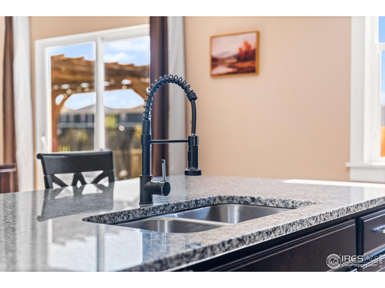 503 Buckrake Street Severance, CO 80550 - Photo 10 of 40 a bathroom with a granite countertop sink and a mirror