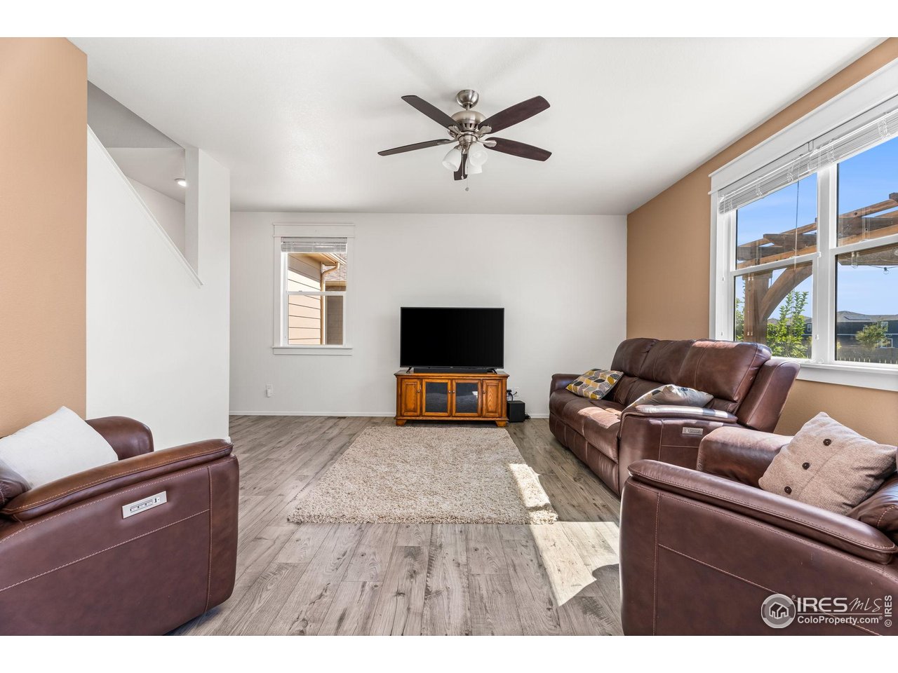 503 Buckrake Street Severance, CO 80550 - Photo 18 of 40 a living room with furniture and a flat screen tv