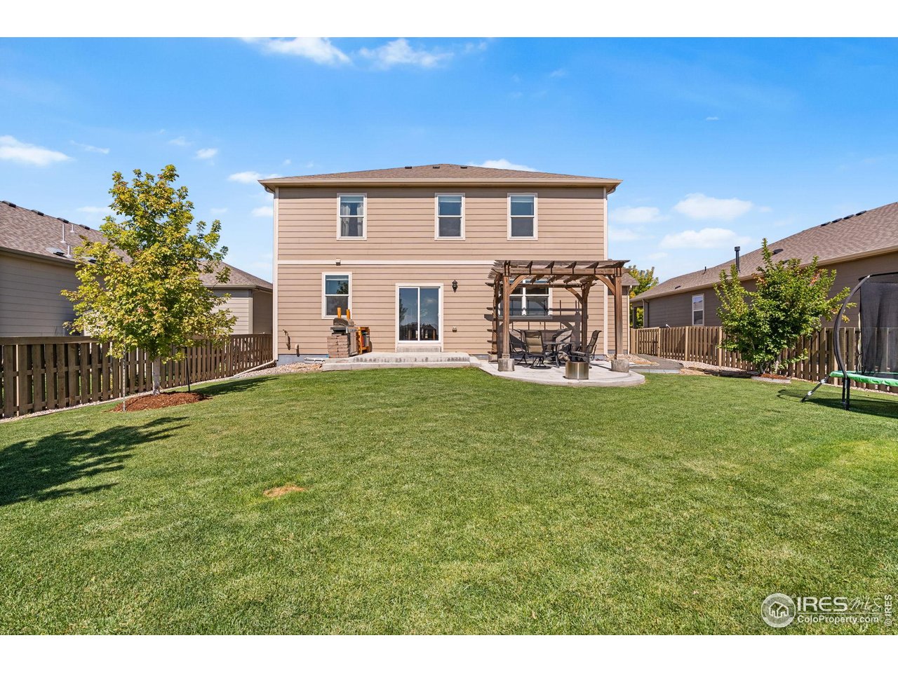 503 Buckrake Street Severance, CO 80550 - Photo 32 of 40 a view of a house with a backyard