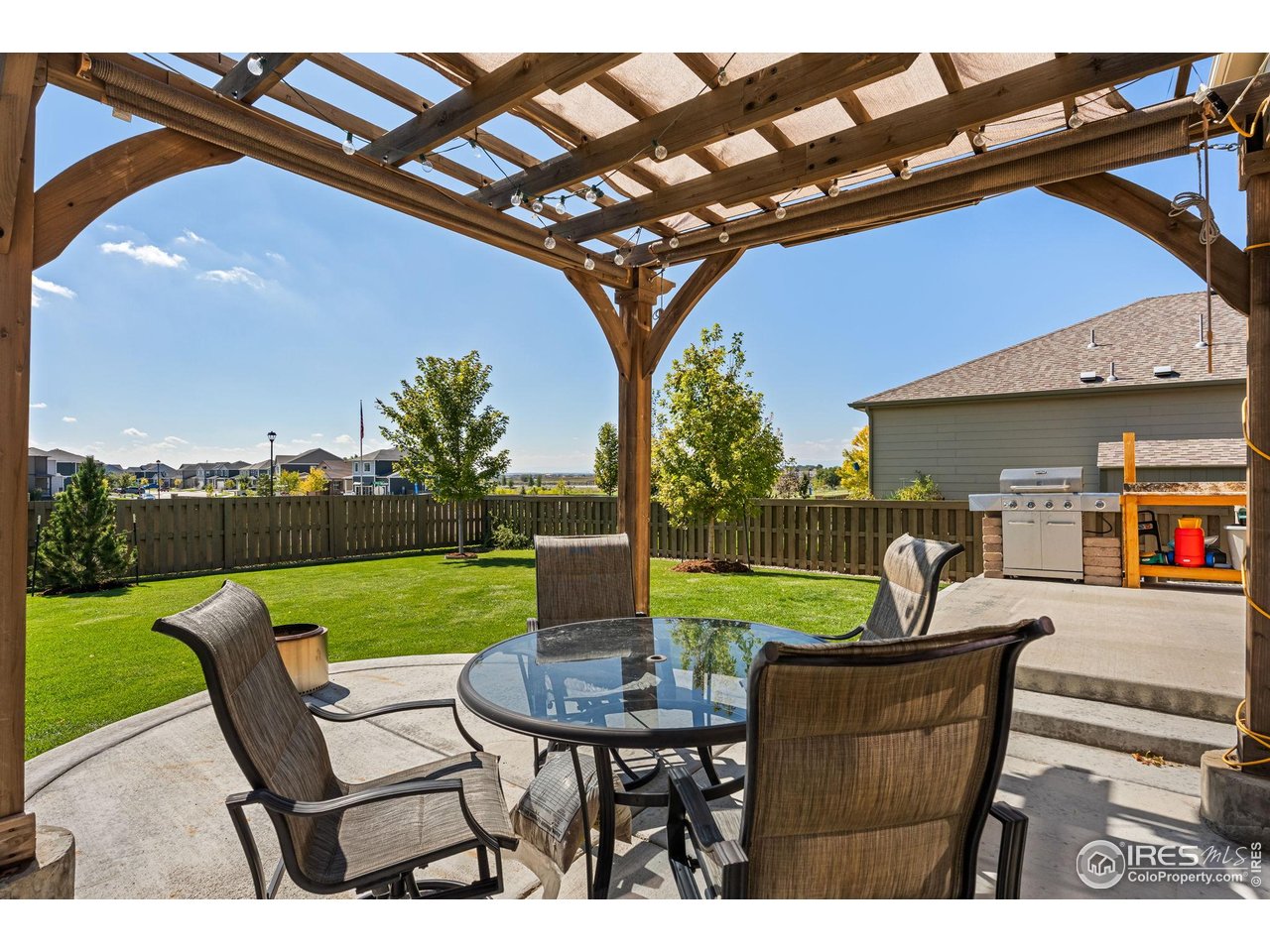 503 Buckrake Street Severance, CO 80550 - Photo 33 of 40 a view of a chairs and table in patio with a yard