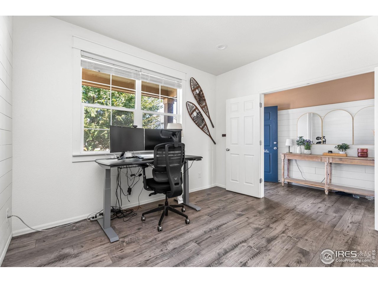 503 Buckrake Street Severance, CO 80550 - Photo 6 of 40 a view of a workspace with furniture and a window
