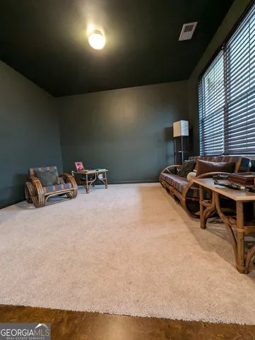 a bedroom with a bed and a night stand