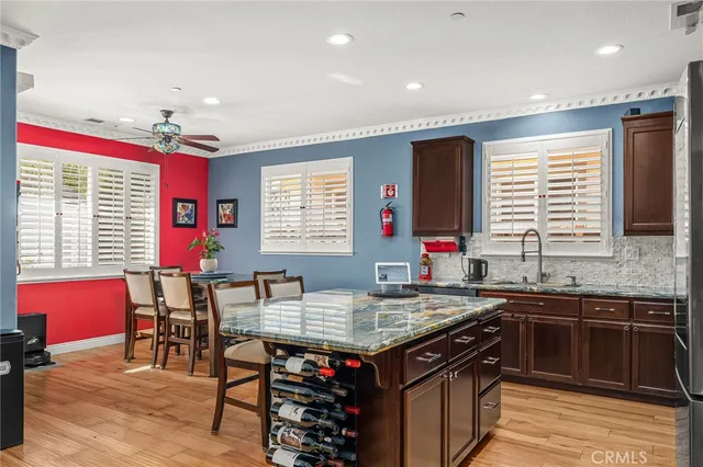 a kitchen with stainless steel appliances granite countertop a stove and a refrigerator